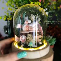 Illuminated glass dome with baby rabbit in miniature garden, baby shower gift