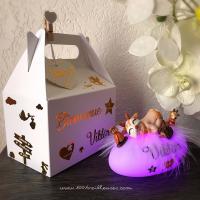 Beautiful customizable white gift box with its personalized night light in fawn colors, angled view